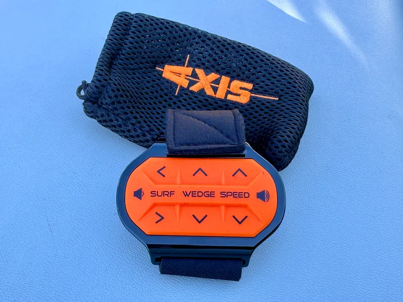 Slide: The Image of Axis Wake Research A24 2022 remote control with pouch on blue background. - 43