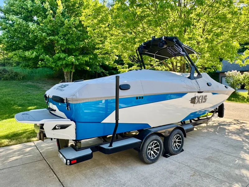 Slide: The Image of 2022 Axis Wake Research A24 boat on trailer outdoors. - 47
