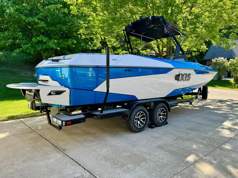 Slide: The Image of 2022 Axis Wake Research A24 boat on trailer outdoors. - 5