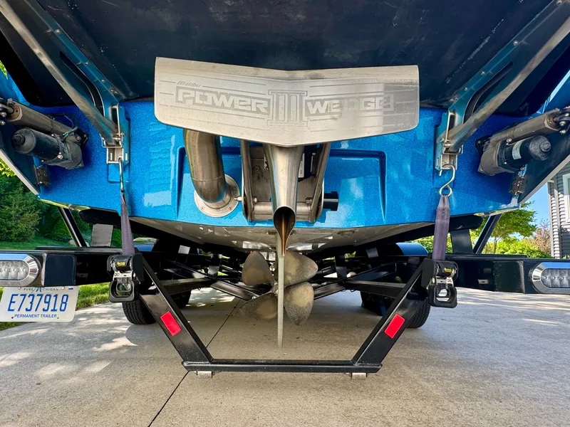 Slide: The Image of Rear view of a blue 2022 Axis Wake Research A24 boat. - 7