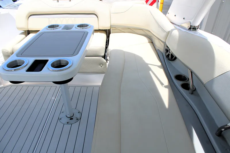 Slide: The Image of Luxurious seating area on a 2021 Regal 26 OBX boat with cupholders and table. - 18