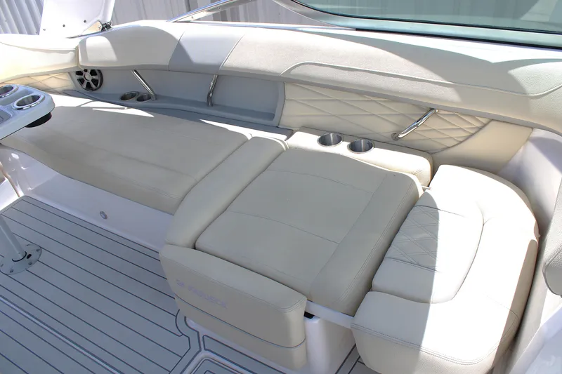 Slide: The Image of Luxurious seating area on a 2021 Regal 26 OBX boat with cup holders and elegant design. - 22