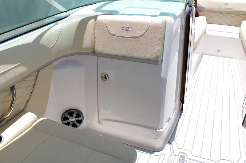 Slide: The Image of 2021 Regal 26 OBX boat interior with beige seating and sleek design. - 23