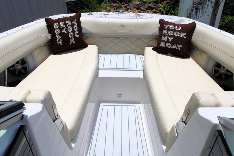 Slide: The Image of Luxurious seating on 2021 Regal 26 OBX boat with decorative pillows. - 30