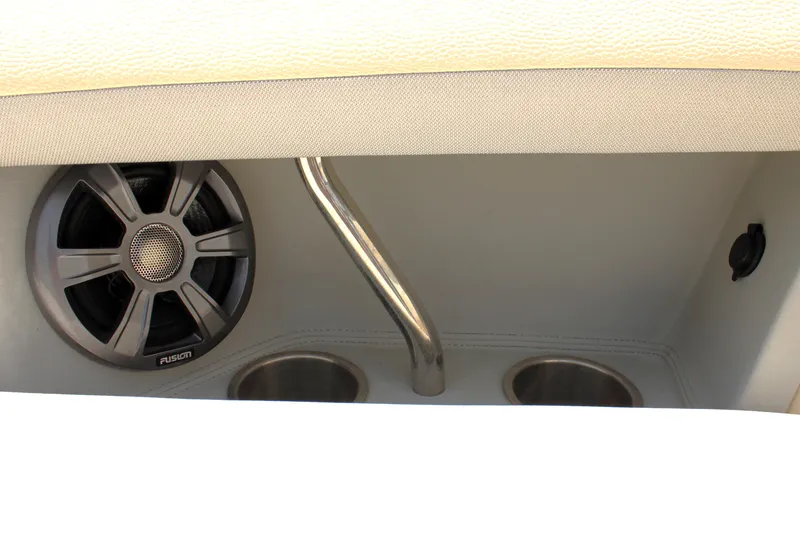 Slide: The Image of Speaker and cup holders in 2021 Regal 26 OBX boat interior. - 33