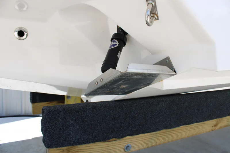 Slide: The Image of 2021 Regal 26 OBX boat trim tab and actuator detail. - 37