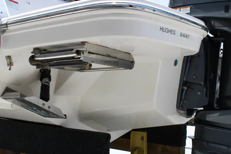 Slide: The Image of 2021 Regal 26 OBX boat stern with ladder and motor detail. - 39
