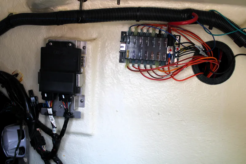Slide: The Image of Electrical wiring and fuse panel inside a 2021 Regal 26 OBX boat. - 40