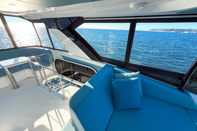 Slide: The Image of Luxurious interior of 2027 Cruisers Yachts 50 Fly with ocean view. - 51