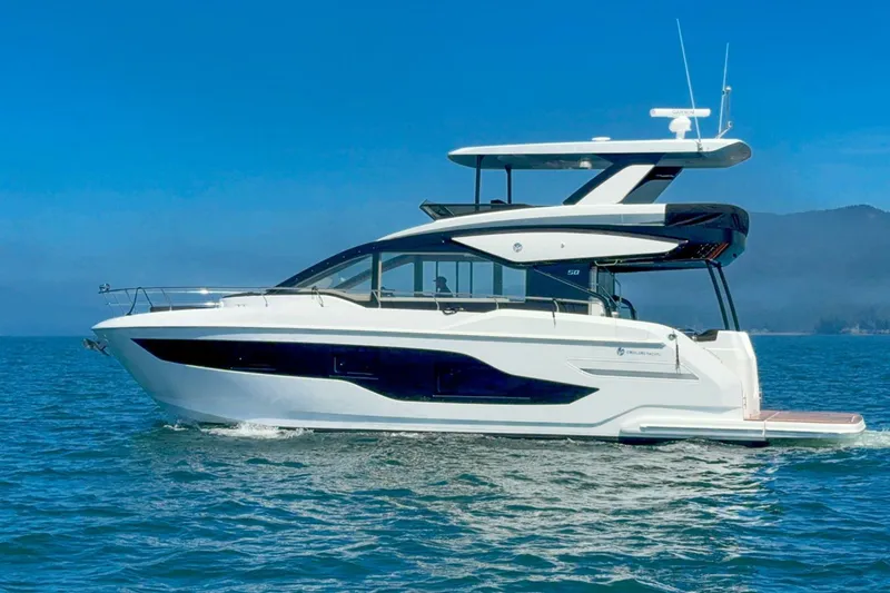 Slide: The Image of 2027 Cruisers Yachts 50 Fly luxury yacht cruising on open water. - 1