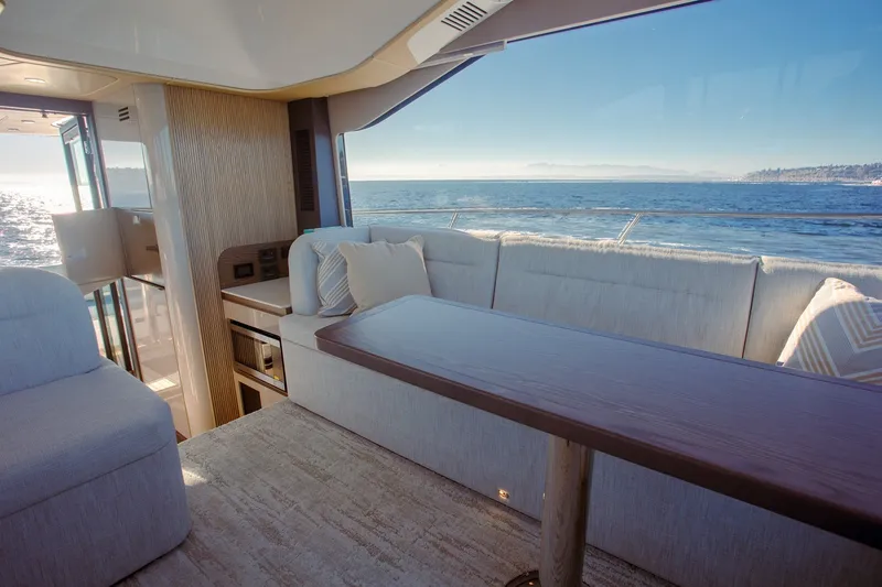 Slide: The Image of Luxurious interior of 2027 Cruisers Yachts 50 Fly with ocean view and elegant seating. - 21