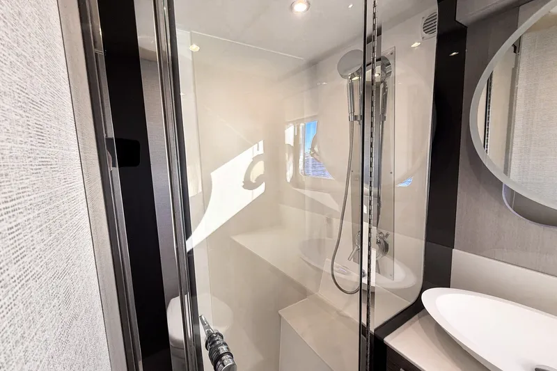 Slide: The Image of Luxurious bathroom in 2027 Cruisers Yachts 50 Fly, featuring modern shower and sleek design. - 38