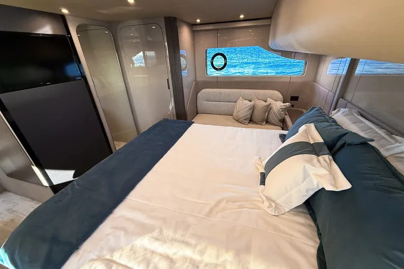 Slide: The Image of Luxurious bedroom interior of 2027 Cruisers Yachts 50 Fly with elegant bedding and modern design. - 42