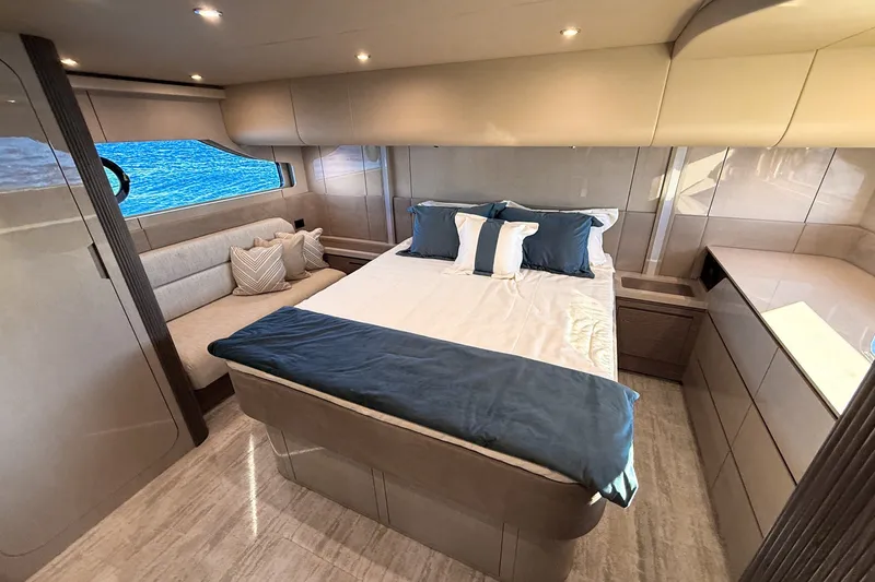 Slide: The Image of Luxurious bedroom interior of 2027 Cruisers Yachts 50 Fly, featuring elegant design and ocean view. - 39