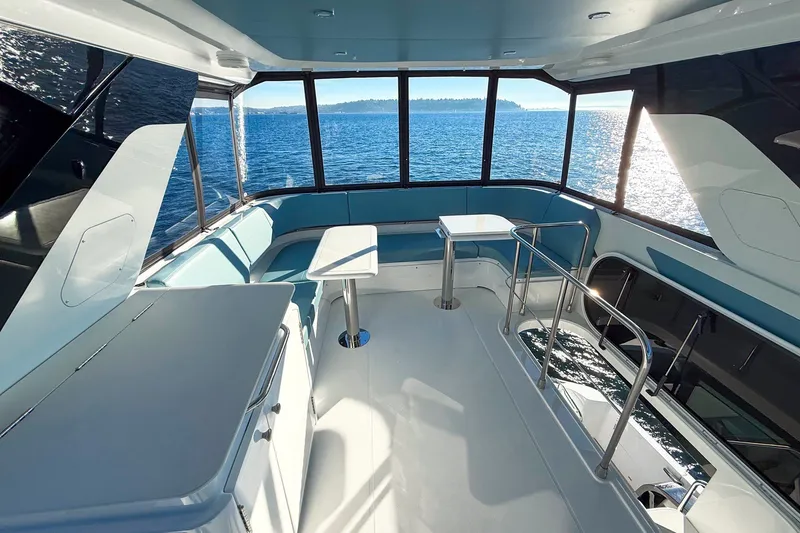 Slide: The Image of Luxurious interior of 2027 Cruisers Yachts 50 Fly with panoramic ocean views. - 46