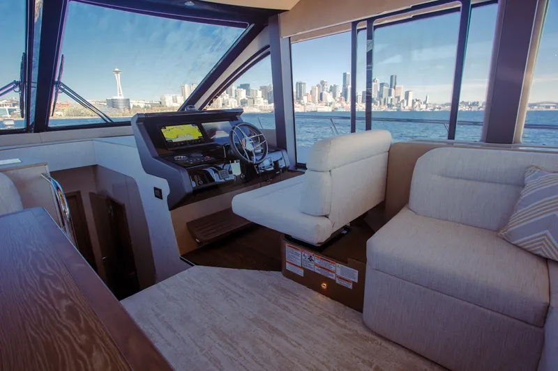 Slide: The Image of Luxurious interior of 2027 Cruisers Yachts 50 Fly with city skyline view. - 22