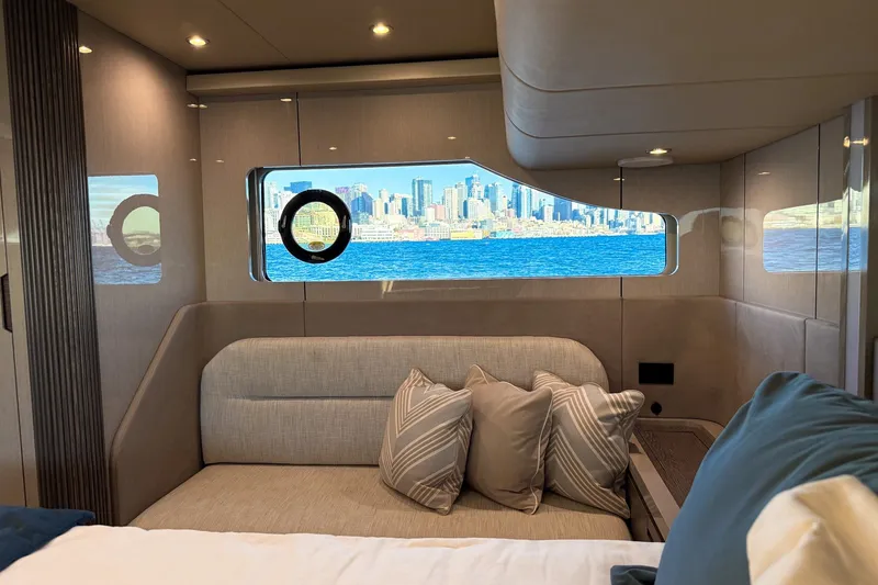 Slide: The Image of Luxurious interior of 2027 Cruisers Yachts 50 Fly with city skyline view. - 41
