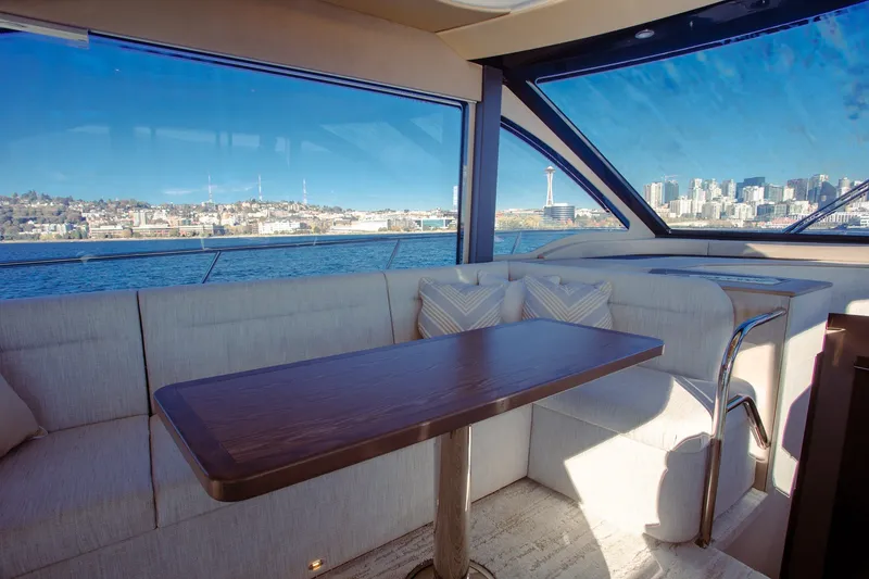 Slide: The Image of Luxurious interior of 2027 Cruisers Yachts 50 Fly with city skyline view. - 18