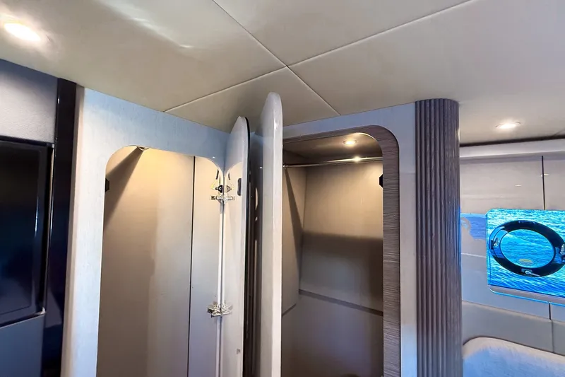 Slide: The Image of Luxurious interior of 2027 Cruisers Yachts 50 Fly, featuring modern design and ambient lighting. - 45