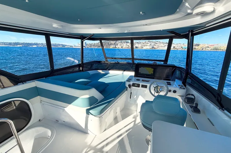 Slide: The Image of Luxurious interior of 2027 Cruisers Yachts 50 Fly with panoramic ocean view. - 48