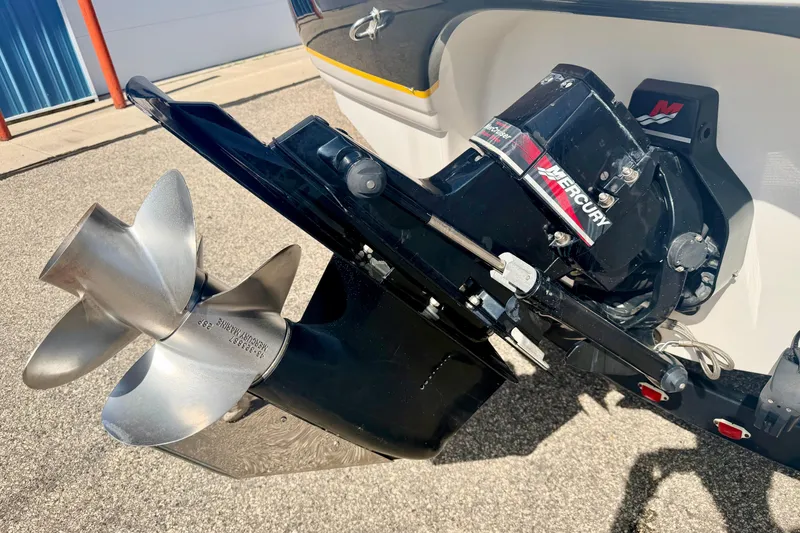 Slide: The Image of 2000 Chaparral 235 SSi boat with Mercury outboard motor and stainless steel propeller. - 17