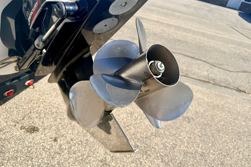 Slide: The Image of Close-up of a 2000 Chaparral 235 SSi boat propeller on pavement. - 18