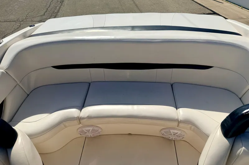 Slide: The Image of Interior seating of a 2000 Chaparral 235 SSi boat with white upholstery. - 23