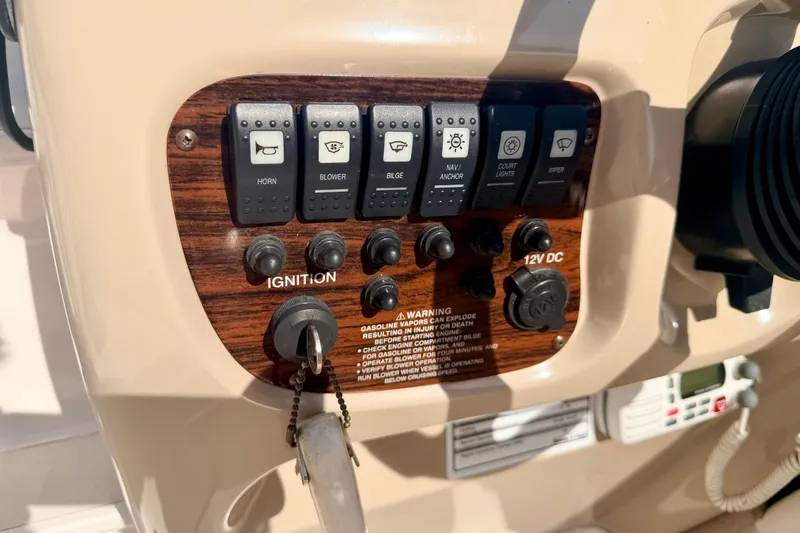 Slide: The Image of Control panel of a 2000 Chaparral 235 SSi boat with ignition and switches. - 34