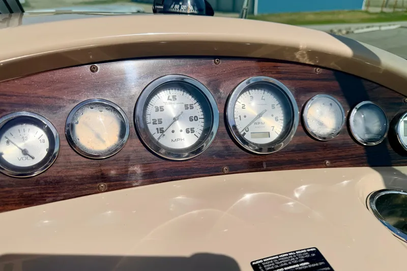 Slide: The Image of Dashboard of a 2000 Chaparral 235 SSi boat with speedometer and gauges. - 37