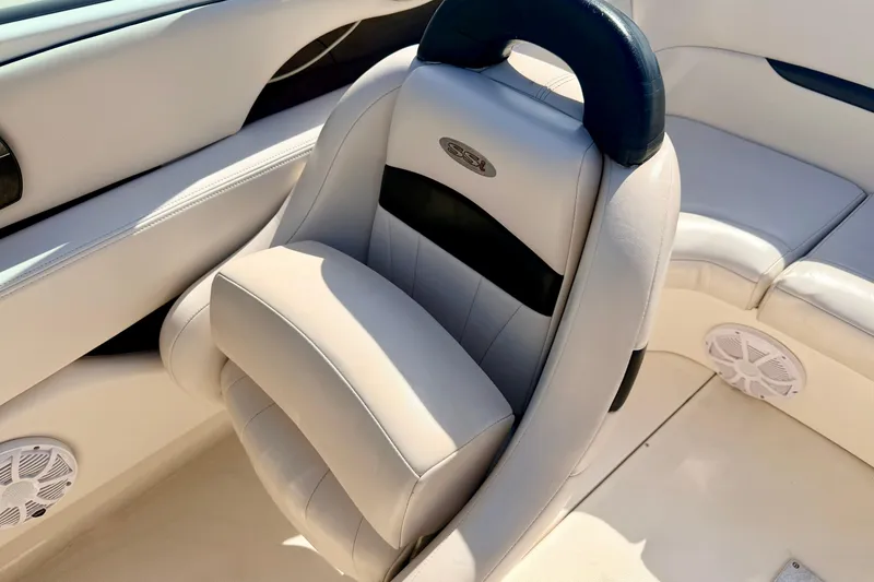 Slide: The Image of Luxury seating in a 2000 Chaparral 235 SSi boat, featuring plush white upholstery. - 40