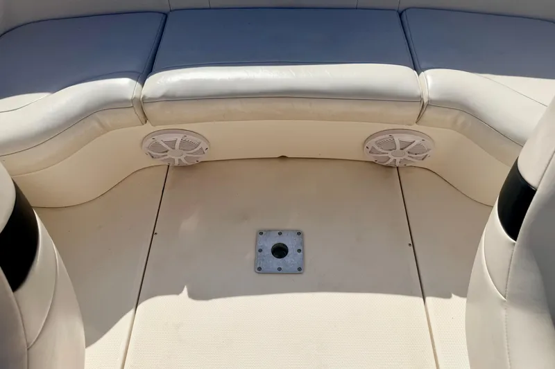 Slide: The Image of Interior of 2000 Chaparral 235 SSi boat with cushioned seating and speakers. - 41
