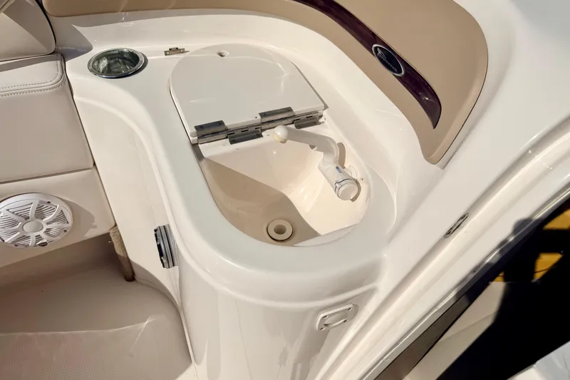 Slide: The Image of 2000 Chaparral 235 SSi boat interior with sink and speaker detail. - 44
