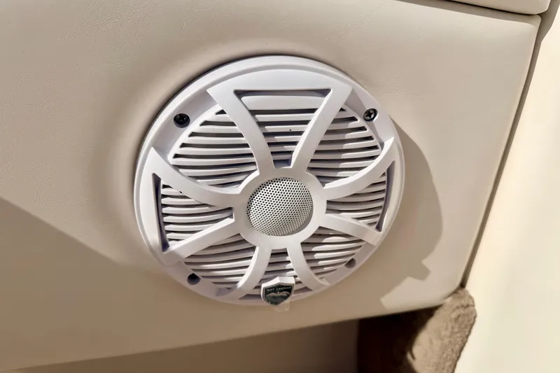 Slide: The Image of White speaker on a 2000 Chaparral 235 SSi boat interior panel. - 47