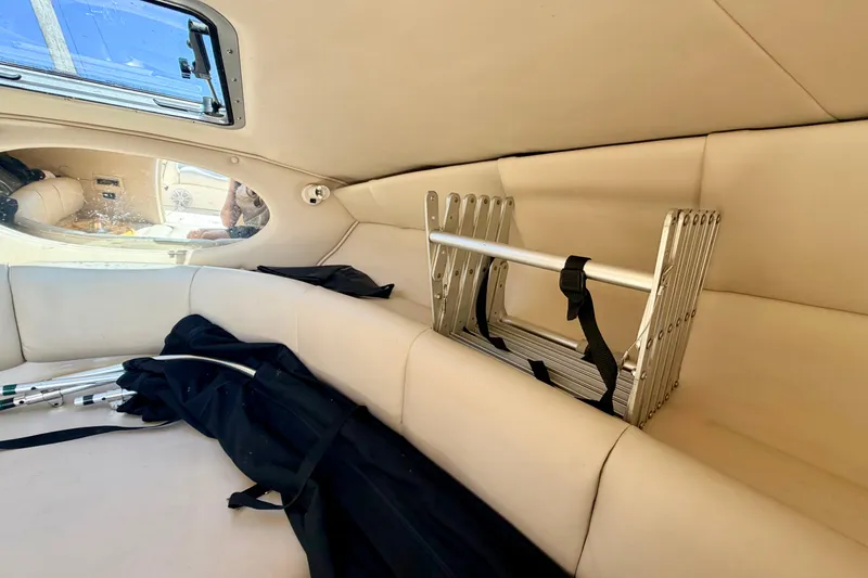Slide: The Image of Interior of 2000 Chaparral 235 SSi boat with folded ladder and seating area. - 57