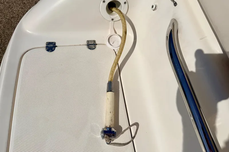 Slide: The Image of Chaparral 235 SSi 2000 boat deck with hose and chrome handle. - 67