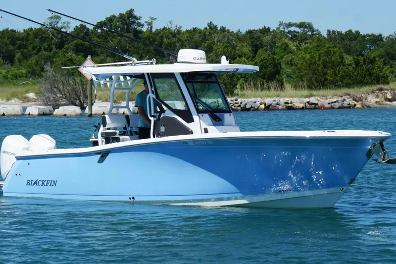 The Image of 2024 Blackfin 272 CC boat on water, featuring sleek design and modern amenities. - 1