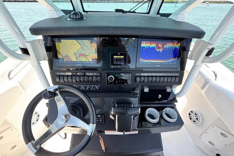 Slide: The Image of 2024 Blackfin 272 CC boat dashboard with advanced navigation and control systems. - 12