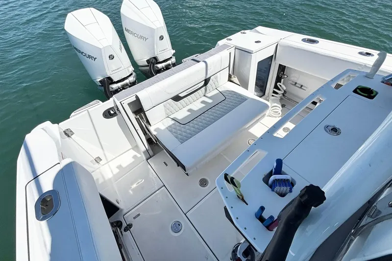 Slide: The Image of 2024 Blackfin 272 CC boat with dual Mercury engines and spacious deck layout. - 16