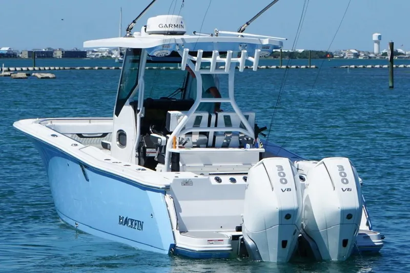 Slide: The Image of 2024 Blackfin 272 CC boat with twin 300 V8 engines on the water. - 8