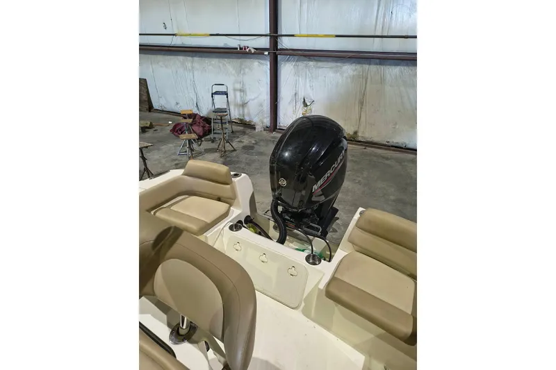 Slide: The Image of 2020 Scout 195 Sportfish boat with Mercury outboard engine in a warehouse. - 10