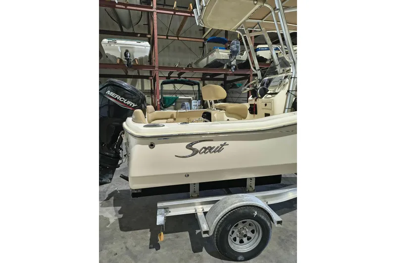 Slide: The Image of 2020 Scout 195 Sportfish boat with Mercury engine on trailer in storage. - 6