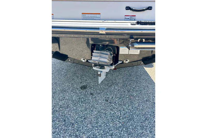 Slide: The Image of Rear view of 2024 Yamaha Boats SX195, showcasing the boat's propulsion system. - 16