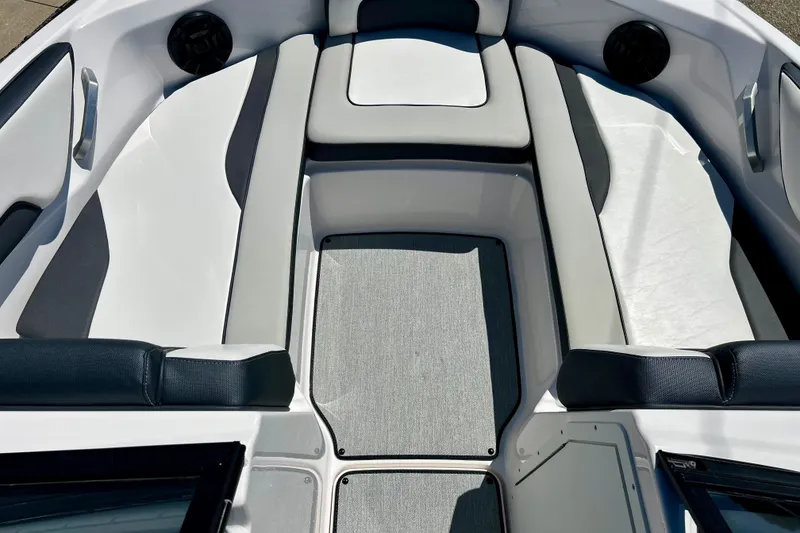 Slide: The Image of 2024 Yamaha Boats SX195 interior seating area with sleek design and comfortable upholstery. - 23