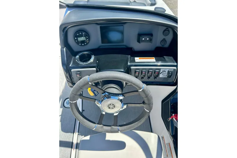 Slide: The Image of 2024 Yamaha Boats SX195 dashboard with steering wheel and control panel. - 36