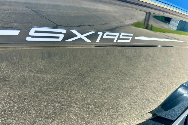 Slide: The Image of 2024 Yamaha Boats SX195 model name on sleek boat exterior. - 56