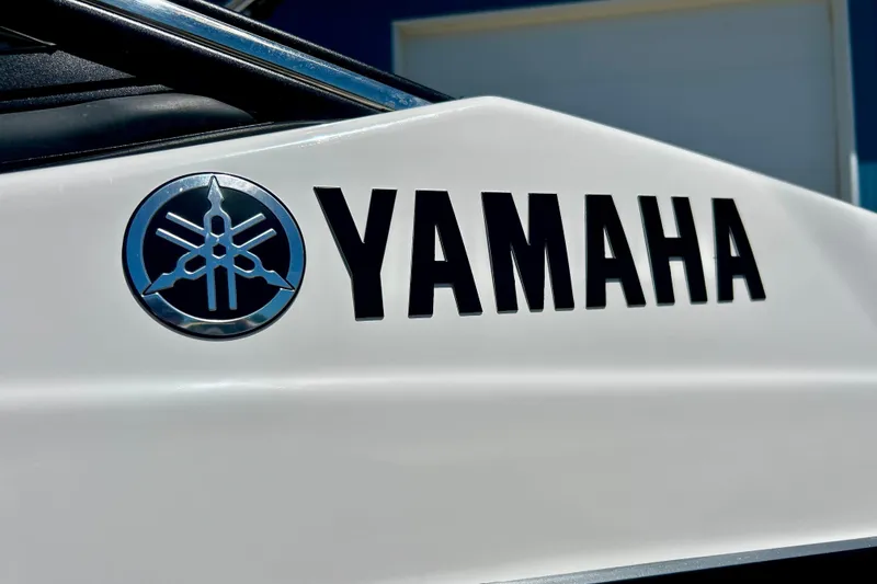 Slide: The Image of 2024 Yamaha Boats SX195 logo on sleek white surface. - 58