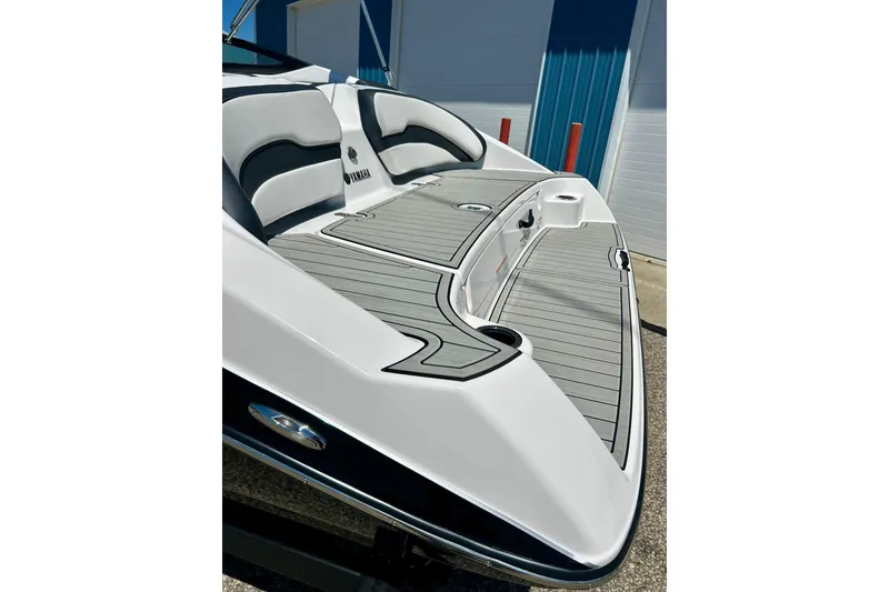 Slide: The Image of 2024 Yamaha Boats SX195, sleek deck design with modern seating and stylish accents. - 60