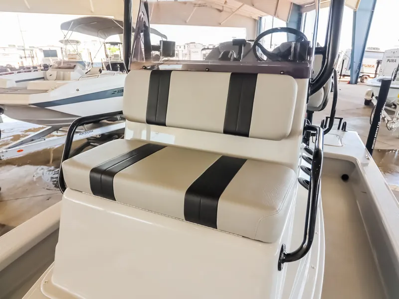 Slide: The Image of The image shows the seating area of a 2026 Majek M2 Illusion boat with cushioned seats. - 12