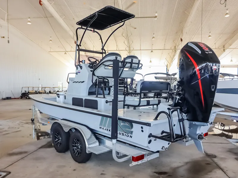 Slide: The Image of A 2026 Majek M2 Illusion boat sits on a trailer in a warehouse. - 4