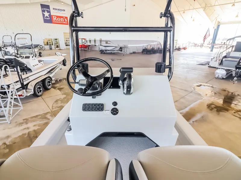 Slide: The Image of The image shows the cockpit of a 2026 Majek M2 Illusion boat in a showroom. - 14